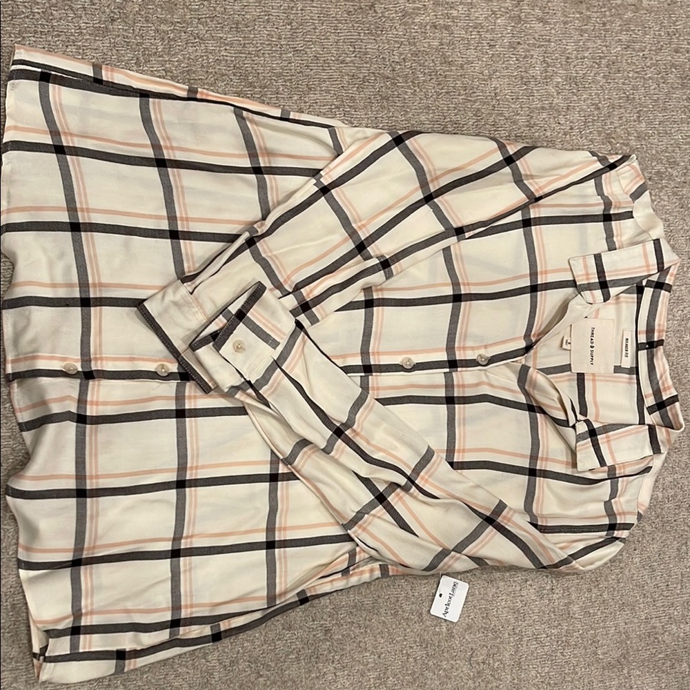 Women’s size small button down long sleeve blouse.